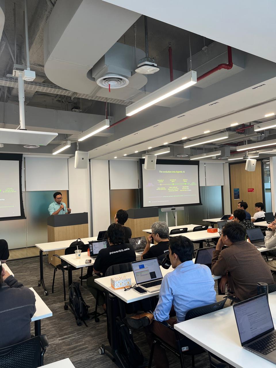 Attendees gathered around the AWS AgentCore area.
